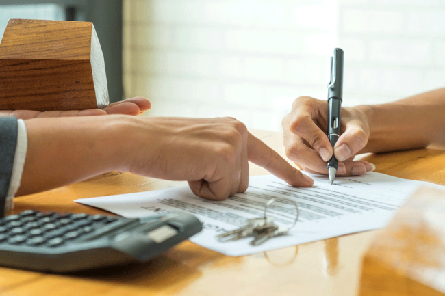 Reverse 1031 Exchange Man Signing Bank Loan